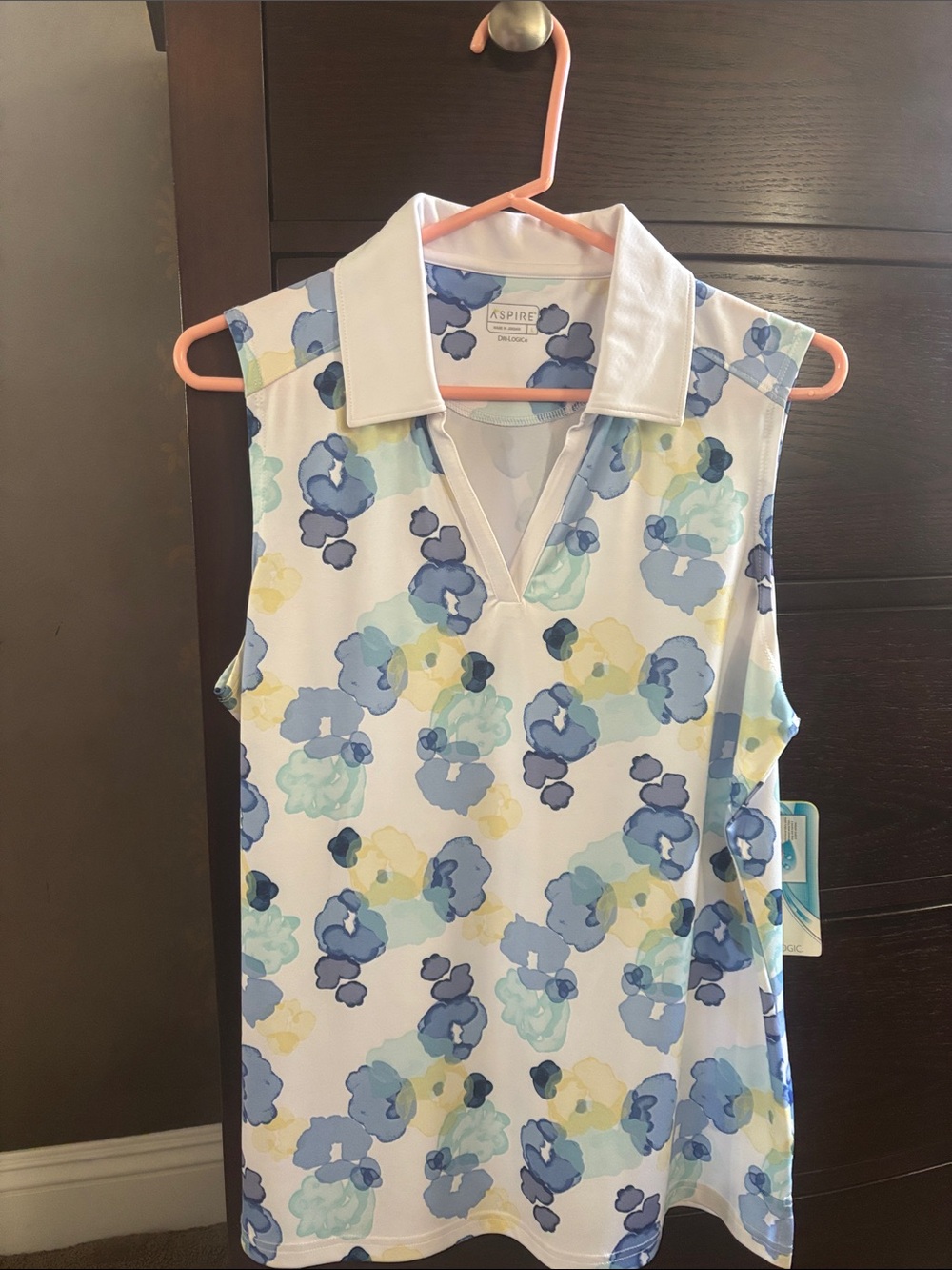Aspire Women’s Sleeveless Polo in White with Blue & Yellow Floral Print
